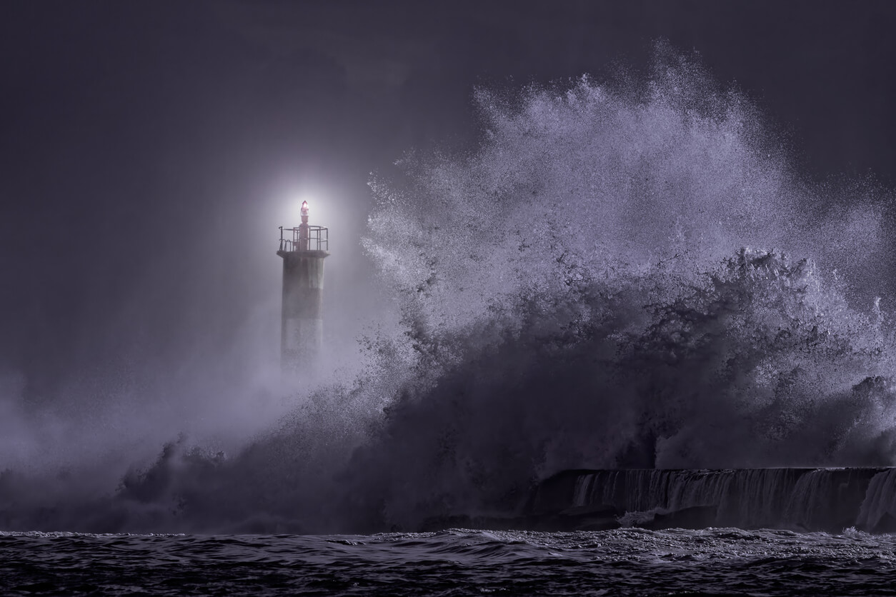 River mouth lighthouse seeing big stormy sea wave at night